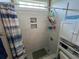 Modern tiled shower stall with built-in shelves, offering a sleek and organized bathing experience at 4008 Tupelo Ct., Conway, SC 29526