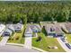 Aerial view of a home with well-maintained lawn, landscaping, and a storage shed in the backyard at 404 Windermere Lake Circle, Conway, SC 29526