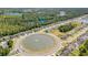Aerial view of the community highlighting the neighborhood design and pond, set among lush trees at 404 Windermere Lake Circle, Conway, SC 29526