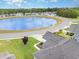 Aerial view overlooking community pond, manicured lawns, and residential neighborhood at 404 Windermere Lake Circle, Conway, SC 29526