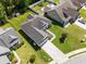 Aerial view of a well-maintained home with a large roof, green lawn, and tidy landscaping at 404 Windermere Lake Circle, Conway, SC 29526