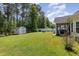 Large, well-manicured backyard with white vinyl fence, storage shed, and plenty of room to enjoy at 404 Windermere Lake Circle, Conway, SC 29526