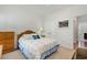 Bright bedroom featuring a bed with patterned bedding and a dark wood dresser at 404 Windermere Lake Circle, Conway, SC 29526