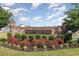 Baron's Bluff North brick entrance sign surrounded by lush landscaping, offering a welcoming touch at 404 Windermere Lake Circle, Conway, SC 29526