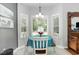 Charming dining area bathed in natural light, featuring a round table, perfect for enjoying meals with a view at 404 Windermere Lake Circle, Conway, SC 29526