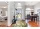 Inviting foyer boasts hardwood floors, an open floor plan, and decorative rug that leads to the dining area and bedroom at 404 Windermere Lake Circle, Conway, SC 29526