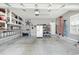Spacious garage with storage cabinets and overhead lighting at 404 Windermere Lake Circle, Conway, SC 29526