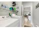 Well-lit laundry room with white appliances and wire shelving for storage at 404 Windermere Lake Circle, Conway, SC 29526