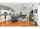 Open-concept living room featuring hardwood floors, vaulted ceilings, and a view into the kitchen at 404 Windermere Lake Circle, Conway, SC 29526