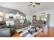 Spacious living room with hardwood floors, vaulted ceilings, and lots of natural light at 404 Windermere Lake Circle, Conway, SC 29526