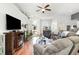 Open-concept living room featuring hardwood floors, vaulted ceilings, and natural light at 404 Windermere Lake Circle, Conway, SC 29526