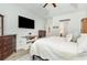 This bedroom features a tray ceiling, dark wood furniture, and a large TV at 404 Windermere Lake Circle, Conway, SC 29526
