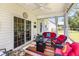 Covered patio with comfortable seating and outdoor decor at 404 Windermere Lake Circle, Conway, SC 29526