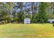 Backyard view of the shed, with double doors for easy access to storage of all types at 404 Windermere Lake Circle, Conway, SC 29526