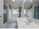 Bright bathroom with a shower, soaking tub, and a vanity featuring a sink and mirror at 4276 Santolina Way # A, Murrells Inlet, SC 29576