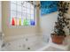 Inviting bathroom with a soaking tub, decorative bottles and a serene ambiance at 4276 Santolina Way # A, Murrells Inlet, SC 29576