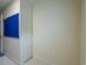An empty room with cream painted walls and a blue cork board at 4276 Santolina Way # A, Murrells Inlet, SC 29576