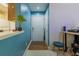 Welcoming entryway with a white door, stylish blue accent wall, and parquet flooring at 4276 Santolina Way # A, Murrells Inlet, SC 29576