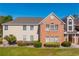 Attractive two-story townhouse featuring a brick facade and well-maintained landscaping at 4276 Santolina Way # A, Murrells Inlet, SC 29576