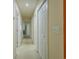 Long hallway with a variety of doors and a neutral color scheme at 4276 Santolina Way # A, Murrells Inlet, SC 29576