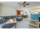 Inviting living room with a comfortable sectional sofa, ceiling fan, and bright natural light at 4276 Santolina Way # A, Murrells Inlet, SC 29576