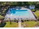 Aerial view of a community outdoor swimming pool with lounge chairs and manicured landscaping in a beautiful location at 4276 Santolina Way # A, Murrells Inlet, SC 29576