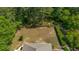 A high-angle aerial image showcases the expansive and fenced backyard of a house at 4363 Parkland Dr., Myrtle Beach, SC 29579