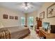 Comfortable bedroom with neutral walls, two bright windows, a ceiling fan, and a cozy bed at 4363 Parkland Dr., Myrtle Beach, SC 29579