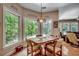 Cozy breakfast nook featuring large windows, a decorative light fixture, and hardwood floors at 4363 Parkland Dr., Myrtle Beach, SC 29579