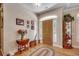 Welcoming entryway with hardwood floors, a wooden front door, and a display cabinet at 4363 Parkland Dr., Myrtle Beach, SC 29579