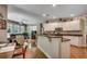 Kitchen with granite island, stainless appliances, white cabinetry open to breakfast nook and living area at 4363 Parkland Dr., Myrtle Beach, SC 29579