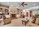 This living room boasts a brick fireplace, custom built-ins, and an archway leading to the dining room at 4363 Parkland Dr., Myrtle Beach, SC 29579