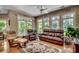 Bright living room with hardwood floors, comfortable seating and large windows at 4363 Parkland Dr., Myrtle Beach, SC 29579
