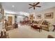 Cozy living room featuring a seating area with sofas and chairs, as well as views into dining area at 4363 Parkland Dr., Myrtle Beach, SC 29579