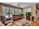 Cozy living room with hardwood floors, large windows, comfortable seating, and natural light at 4363 Parkland Dr., Myrtle Beach, SC 29579