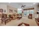 Inviting living room featuring neutral tones, comfortable seating, and French doors leading to the backyard at 4363 Parkland Dr., Myrtle Beach, SC 29579