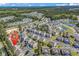 Aerial view of a residential community with houses, a community pool, and lush greenery at 442 Mahogany Dr. # 101, Murrells Inlet, SC 29576