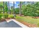 Well maintained backyard featuring lush landscaping and mature trees create a peaceful and private outdoor space at 442 Mahogany Dr. # 101, Murrells Inlet, SC 29576