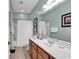 Bright bathroom featuring a shower-tub combo and a large mirror over the vanity at 442 Mahogany Dr. # 101, Murrells Inlet, SC 29576
