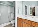 Bright bathroom with a glass-enclosed shower and modern vanity with dual sinks at 442 Mahogany Dr. # 101, Murrells Inlet, SC 29576