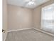 Cozy bedroom with neutral paint, carpet, ceiling fan, and a large window providing natural light at 442 Mahogany Dr. # 101, Murrells Inlet, SC 29576