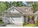 Charming single-Gathering home with attached two-car garage, well-manicured lawn, and inviting front porch at 442 Mahogany Dr. # 101, Murrells Inlet, SC 29576