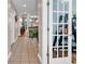 Hallway with tile flooring leading to an open floor plan, with kitchen and living spaces at 442 Mahogany Dr. # 101, Murrells Inlet, SC 29576