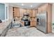 Well-equipped kitchen featuring stainless steel appliances, granite countertops, and lots of storage at 442 Mahogany Dr. # 101, Murrells Inlet, SC 29576