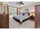 Spacious main bedroom with tray ceiling, ceiling fan, and access to a private balcony at 442 Mahogany Dr. # 101, Murrells Inlet, SC 29576