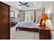 This serene main bedroom offers soft lighting, a tray ceiling, french doors and a beautiful view of the backyard at 442 Mahogany Dr. # 101, Murrells Inlet, SC 29576