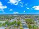 An aerial view showcases a lovely neighborhood with mature trees and nearby lake at 460 Boundary Ave. # A & B, Murrells Inlet, SC 29576