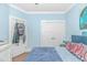 Bedroom with blue walls, and double closet doors at 460 Boundary Ave. # A & B, Murrells Inlet, SC 29576