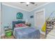 Serene bedroom with blue walls, comfortable bed, and ample natural light at 460 Boundary Ave. # A & B, Murrells Inlet, SC 29576