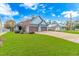 Inviting light blue home with a spacious lawn and convenient two-car garage at 460 Boundary Ave. # A & B, Murrells Inlet, SC 29576
